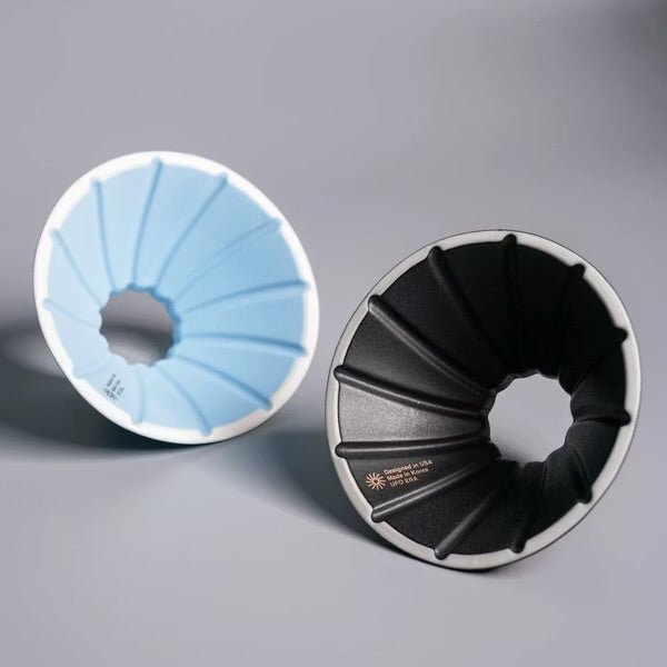 UFO dripper coffee filters in matte black and Carolina blue, designed for optimal brewing and extraction.