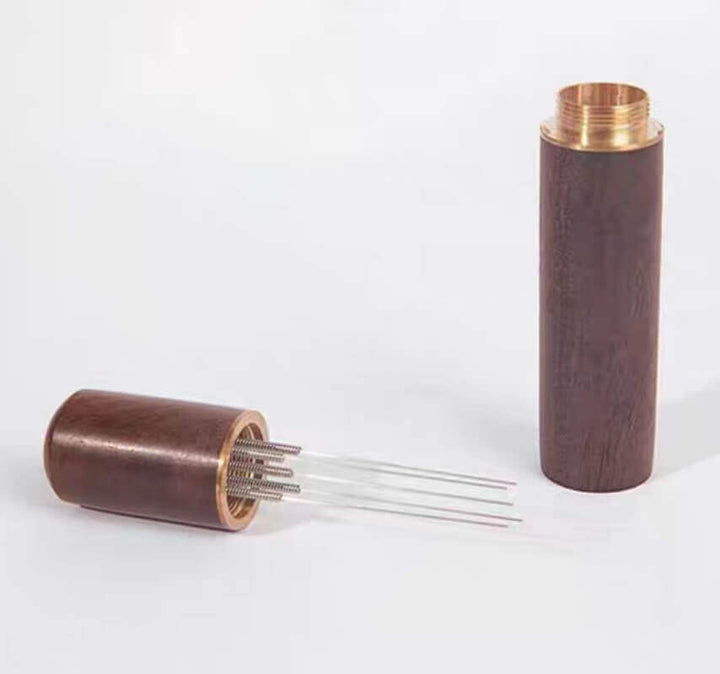 Coffee needle distributor with wooden stand in light wood